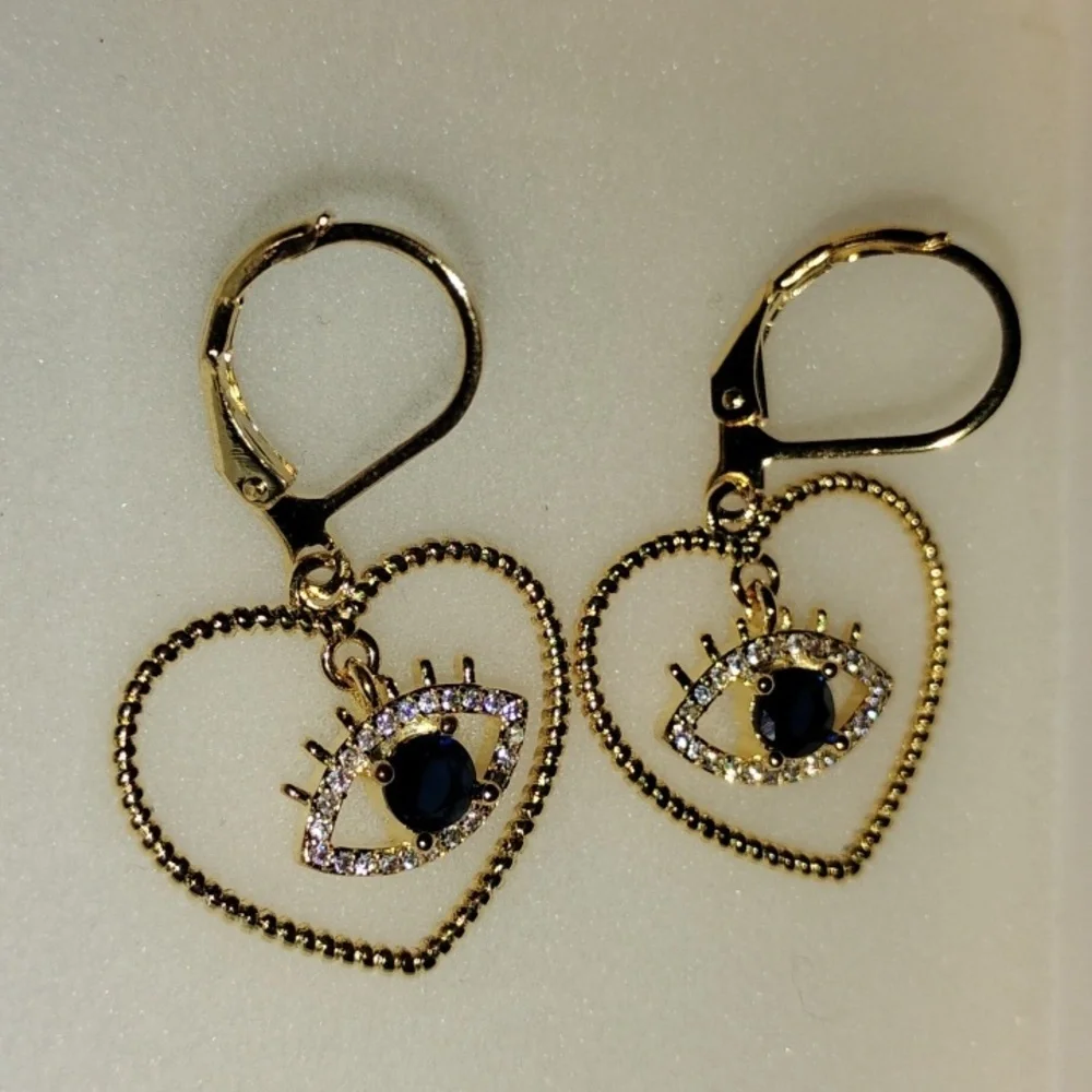 Gold Tone Heart Eye Earrings